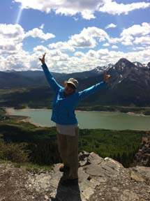 Sue on top of the mountain, loving life after a very steep hike.