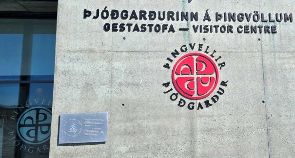 Exterior view of Þingvellir National Park Visitor Centre, showcasing the building's modern architecture and signage.