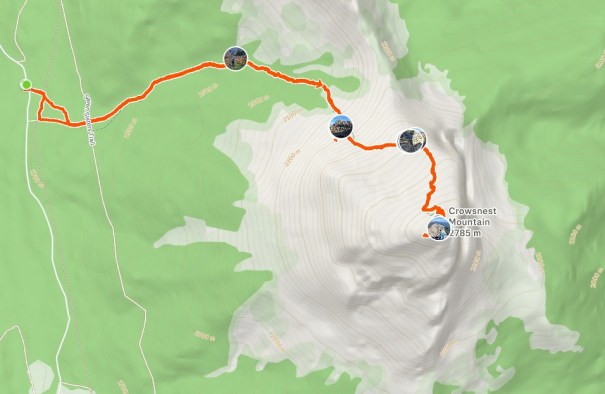 Map showing a hiking route to Crowsnest Mountain with a highlighted orange trail and elevation details.